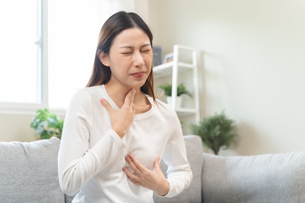 Acid reflux usually feels like a sour taste in the mouth with burning in the throat. (Shutterstock)