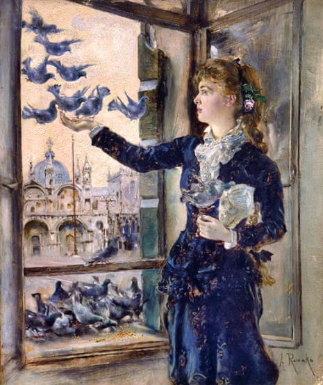 A young woman at a window overlooking St Mark's Square in Venice feeding pigeons