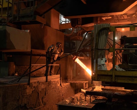 An worker wearing a protective gear works in a continuous steel casting department at the ArcelorMittal steel plant, in Kryvyi Rig