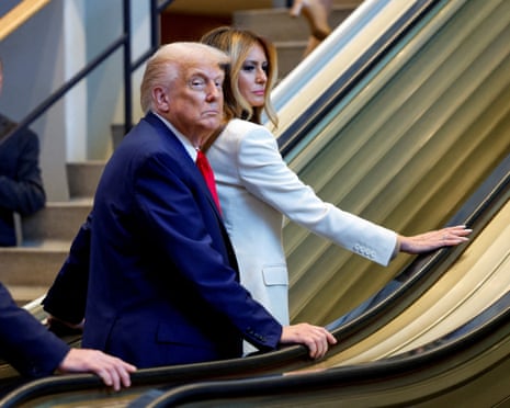 People ride on escalator