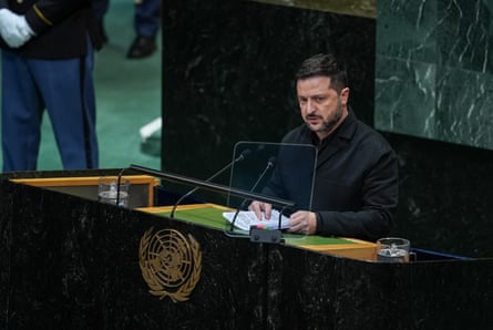 Volodymyr Zelenskyy talks into a microphone at the United Nations General Assembly