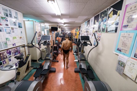 Kanazawa pictured from behind as he walks in his gym