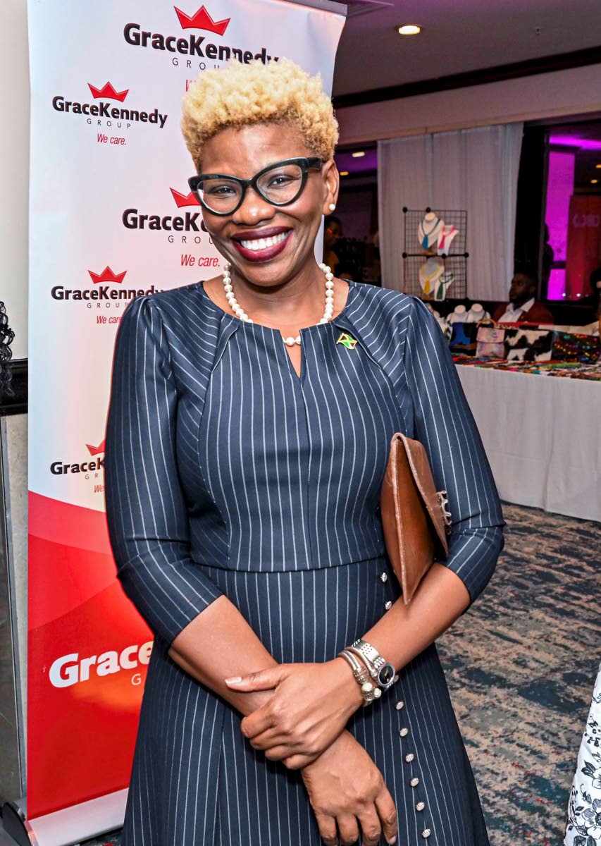 Sonja Linton, vice-president of exports at JAMPRO, dons pinstripes with delicate button accents for the occasion.
