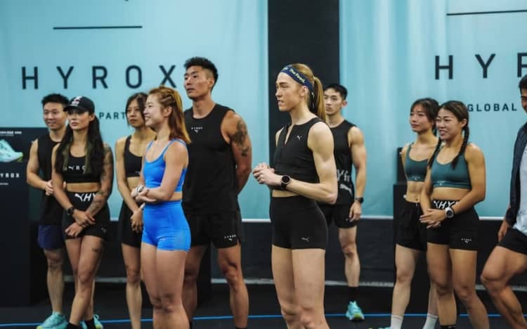 Joanna Wietrzyk (middle in black top) holds the Hyrox Women's Solo Pro world record.