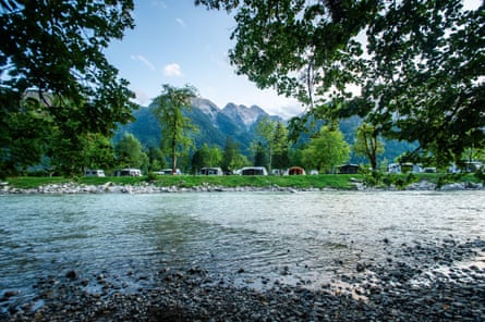 River trees mountains and campsite
