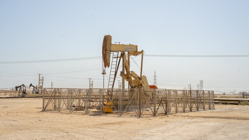 An oil pump jack,oil horse, oil jack, beam pump extracting crude oil from oil well in a desert in the Middle East