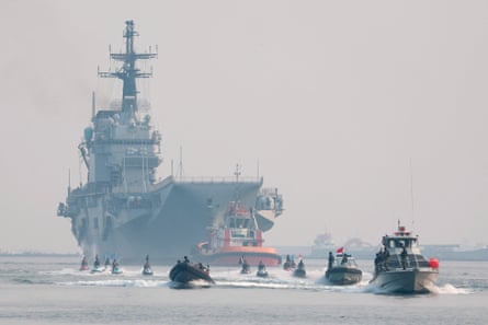 Aircraft carrier escorted by Indonesia’s navy