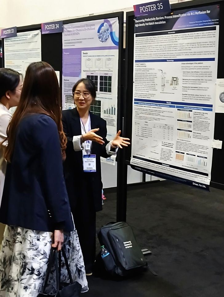 Lee So-jeong, director of Samsung Biologics’ Upstream Process Development Group, explains the company’s technology during a poster presentation at BioProcess International 2026 in Boston. Courtesy of Samsung Biologics