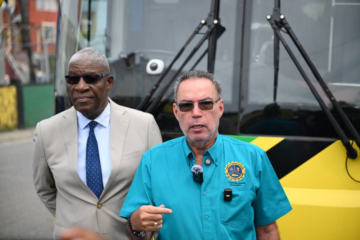 Minister of Energy, Transport and Telecommunications, Daryl Vaz (right), and Managing Director of the Jamaica Urban Transit Company (JUTC), Owen Ellington, at the launch of the JUTC Route 710 service on Wednesday.