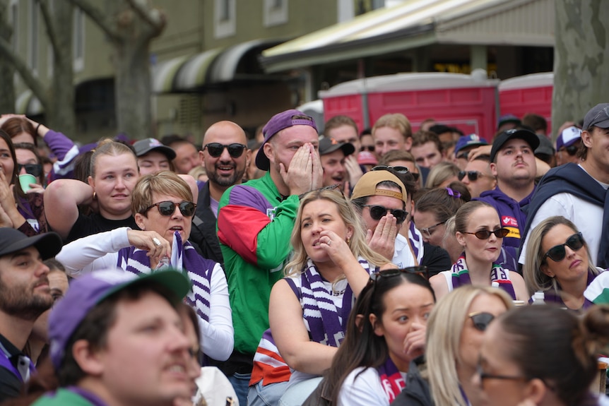 A crowd with a sad look after a loss in 2026 AFL grand final.