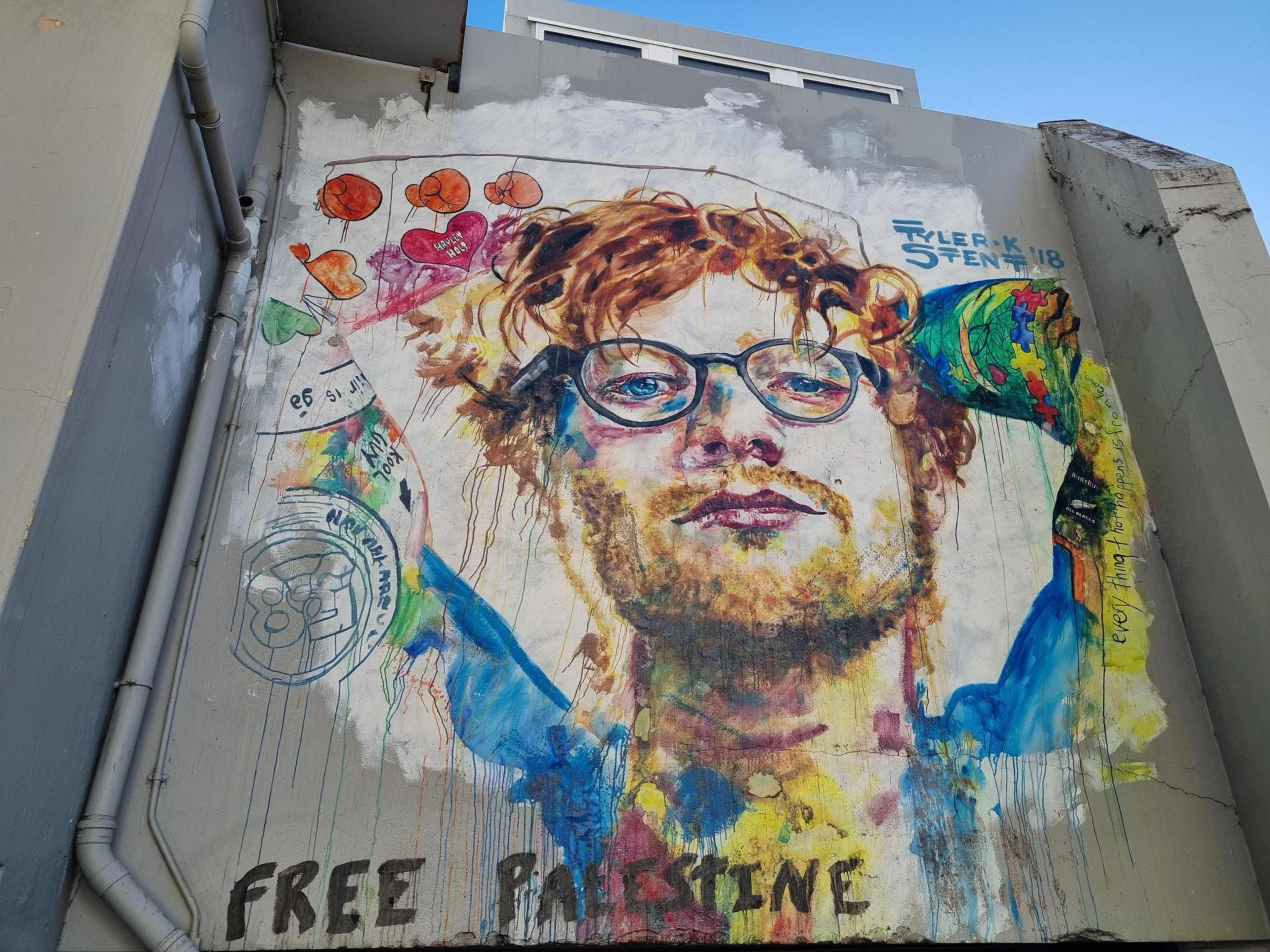 The words "Free Palestine" have been written on the mural.