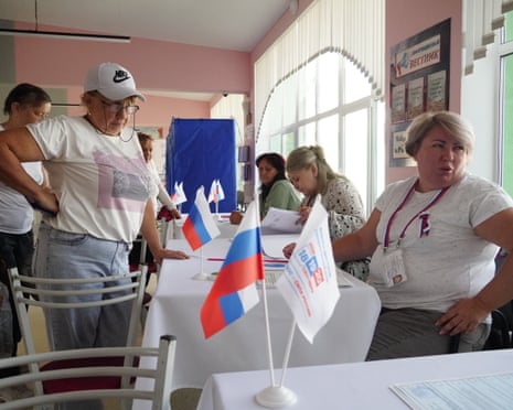 People cast their ballots at a polling station in Mariupol.