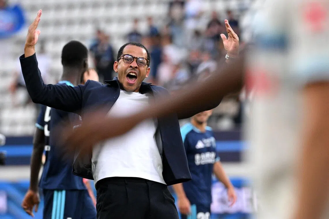Paris FC’s English head coach Liam Rosenior reacts in front Strasbourg’s supporters at the end of the French Ligue 1 football match between Paris FC and RC Strasbourg on Sept 19.