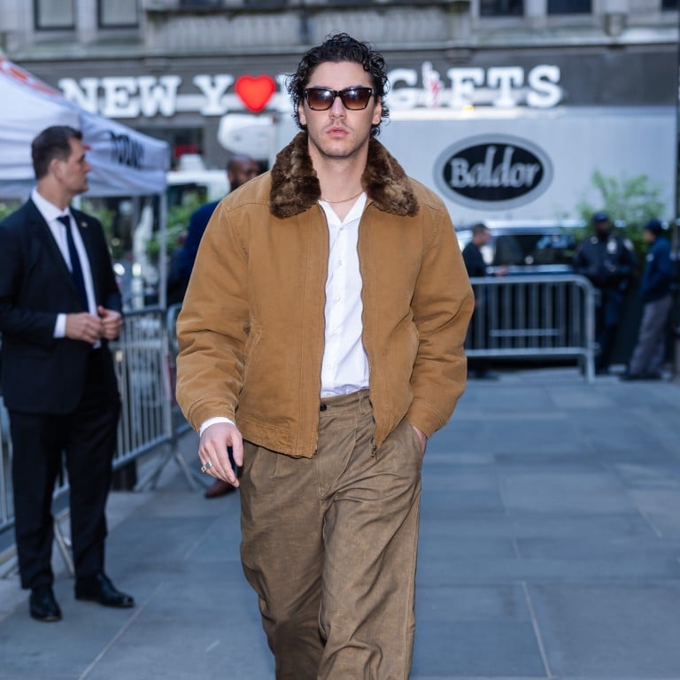 Belmont Cameli in New York City in May, wearing a fur-collar jacket and baggy trousers. Photo: Getty Images
