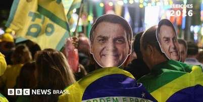 Apoiadores com m&aacute;scaras de Jair Bolsonaro Foto: Reuters / BBC News Brasil