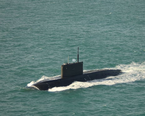 Russian Kilo-class submarine Krasnodar surfaces and moves through open sea water