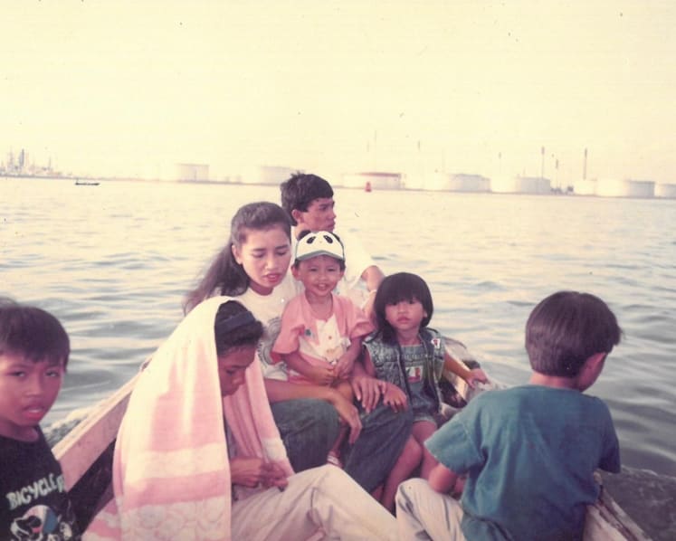 Firdaus Sani and his family on a boat to Pulau Semakau. (Photo: Orang Laut SG)